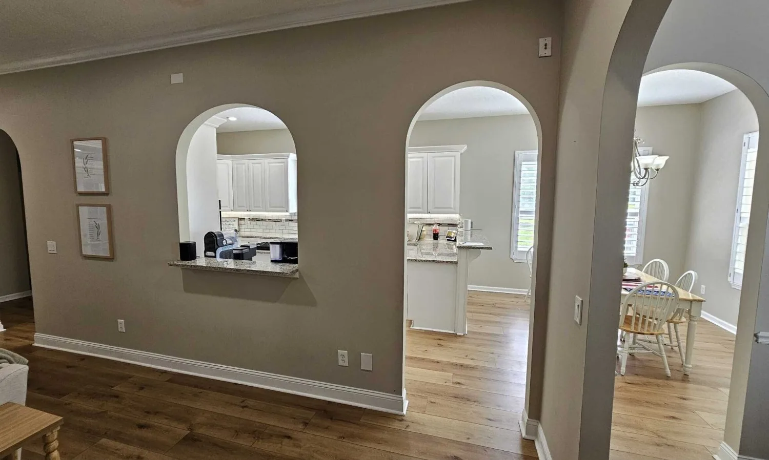 Before: closed-off kitchen behind an arched pass-through wall