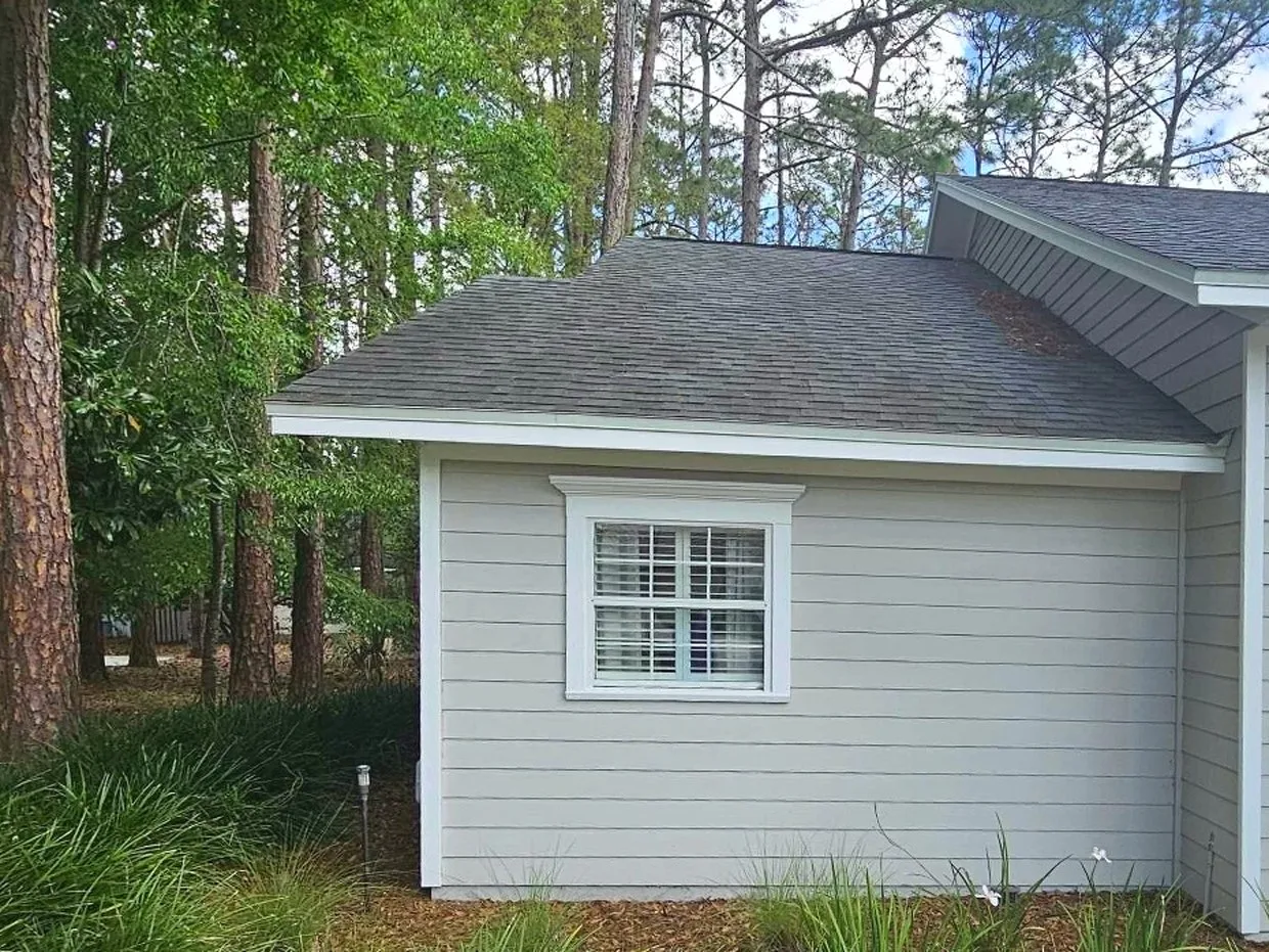Before: the original side wall of the home
