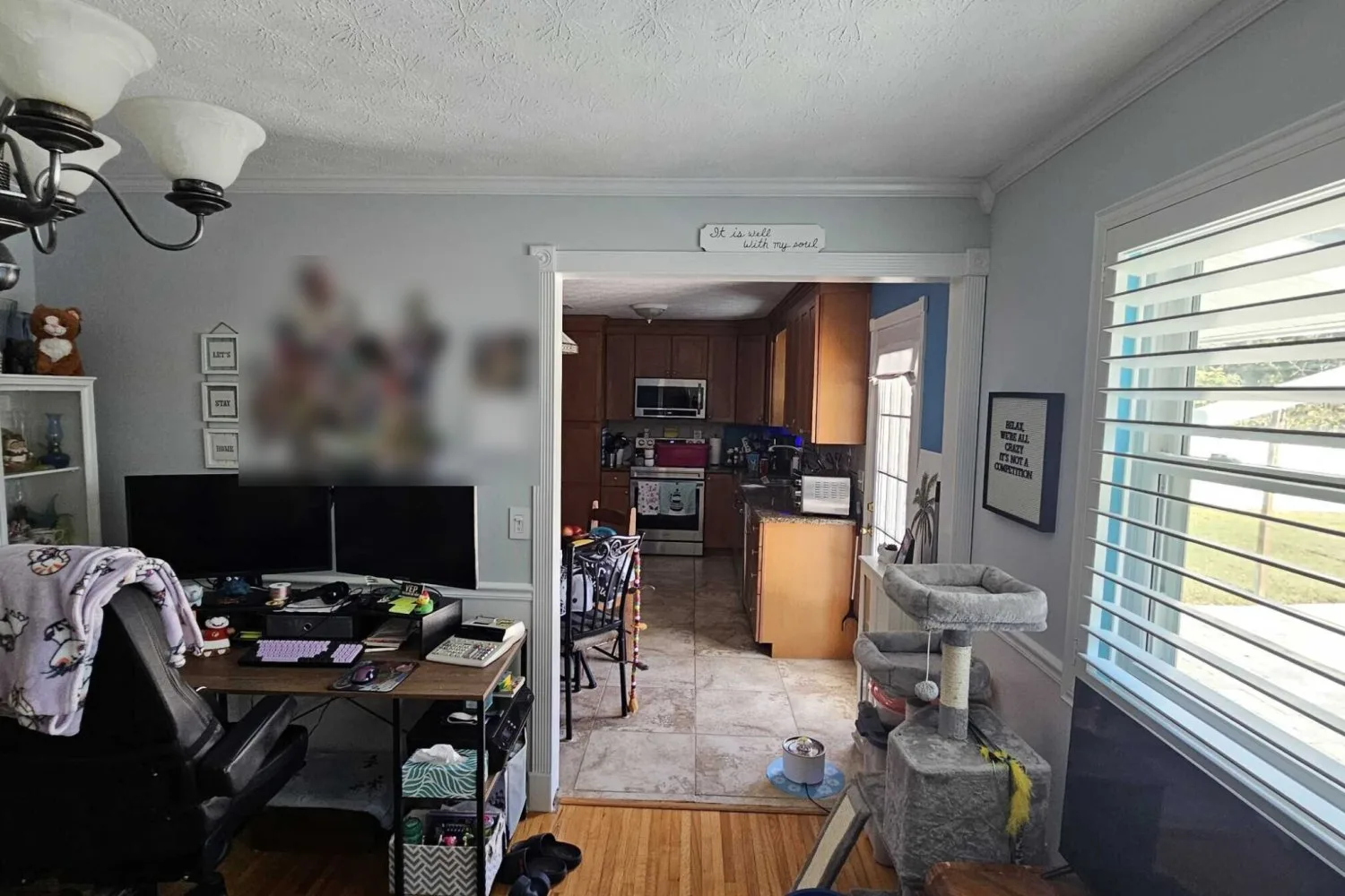 Dining room before remodel with a narrow doorway into a closed kitchen